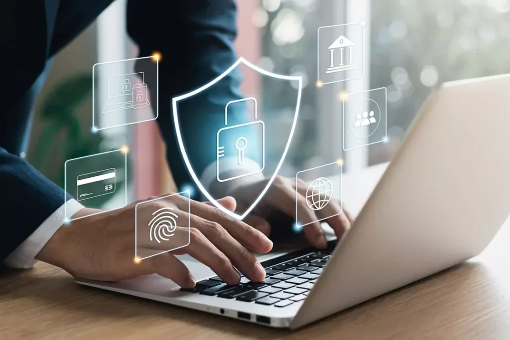 Businessman using a laptop with various security icons, illustrating secure remote access solutions