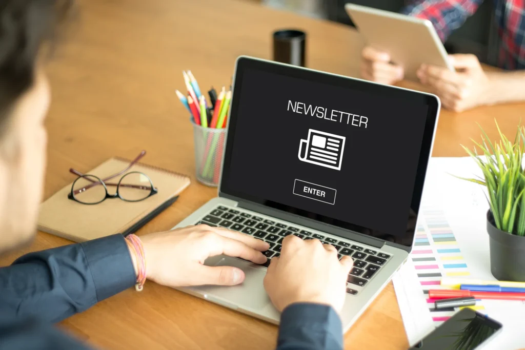 Close-up of a laptop screen illustrating a newsletter concept with an invitation to subscribe for updates