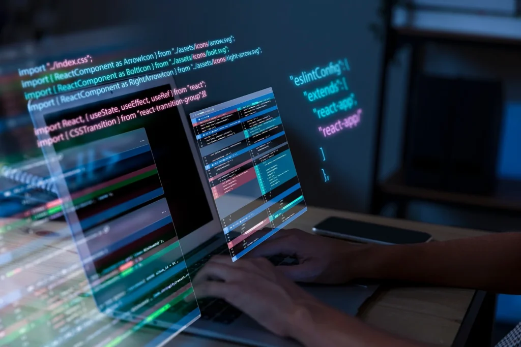 A person typing on a laptop, engaged in virtual IT consulting and assessment work